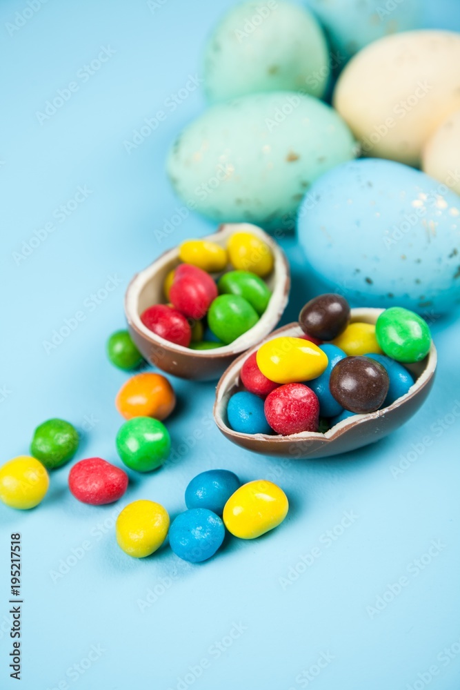 Wall mural Easter eggs on blue background