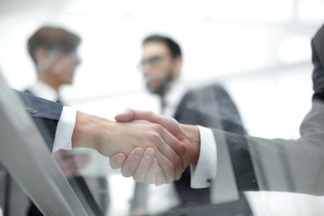 Business men shaking hands. Closeup.