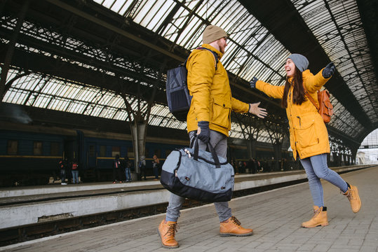 Happy Couple At Railway Station. Meet After Long Time No See Eac