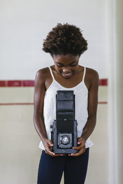 Young Girl with Vintage Camera