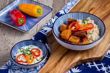 Sweet potato chili in blue bowl on wooden table