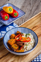 Sweet potato chili in blue bowl on wooden table