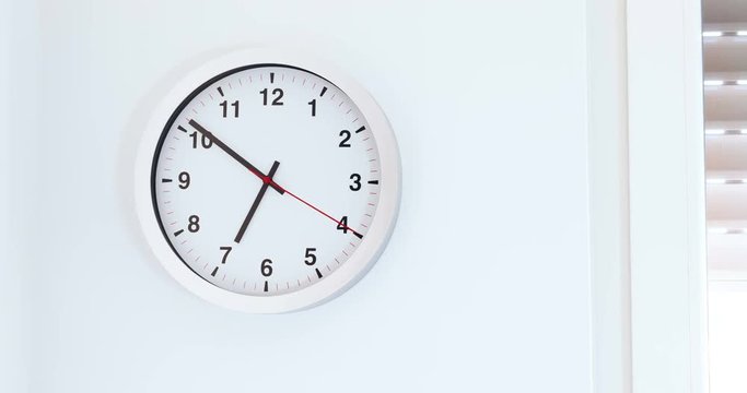 it's seven o'clock already, time to wake up for breakfast, modern white metallic alarm clock on modern white wall background