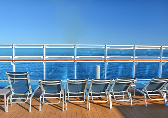 Sunbeds on open deck of cruise ship
