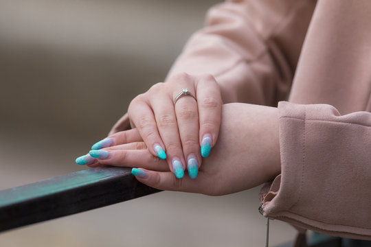 Female Hands With Blue Nails