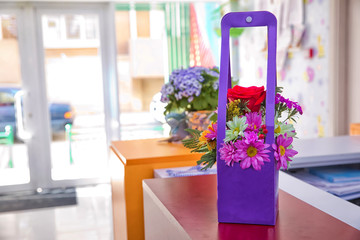 Purple flower bouquet made from paper . Lilac daisy . Purple flower isolated with clipping path . Bouquet of wild flowers clover in a cup