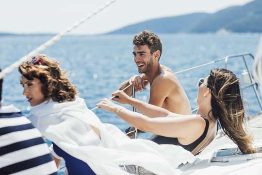 Friends Having Fun on Sailing Boat