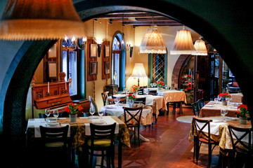 Luxury restaurant interior with setting tables for dining