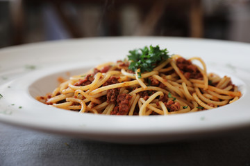 Spaghetti bolognese with beef tometo sauce on wood table , italian food