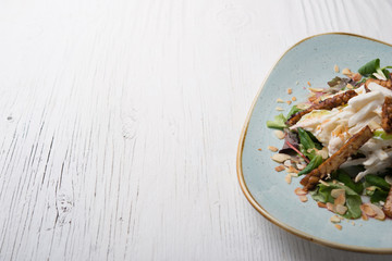 Vegan dish over white wooden background and space for recipe