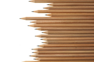 Fototapeta premium Bunch of identical graphite pencils on white background