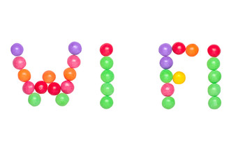 text WI FI written by sweet colorful candy isolated on white background