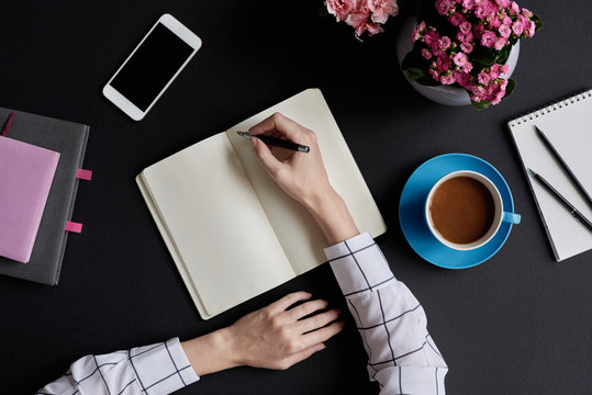 Woman with blank notebook