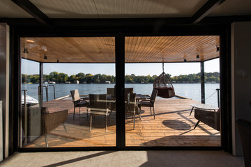 Terrace of log cabin on river