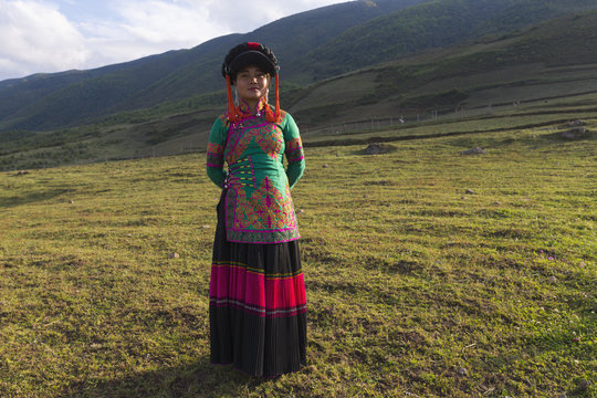 Beautiful Chinese Yi people in traditional costumes  outdoor