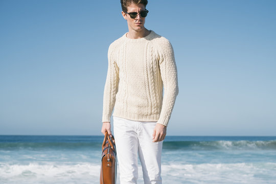 A man walking at the beach