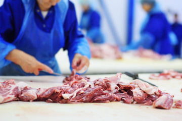 Cutting and processing of meat at a meat-packing plant. Food industry