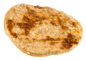 Single grilled hamburger patty isolated on white