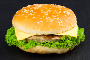  fresh tasty burger on black textured background