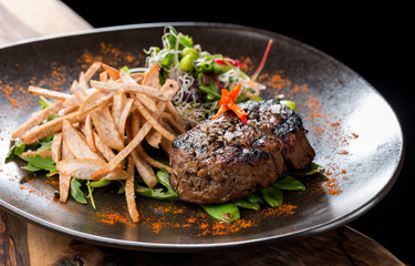 Lemongrass grilled beef steak with snow peas and taro potatoes