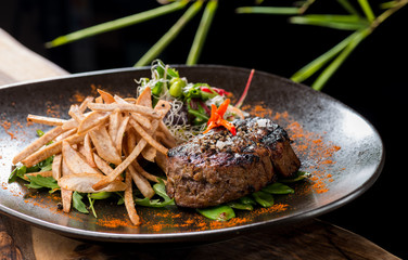Lemongrass grilled beef steak with snow peas and taro potatoes