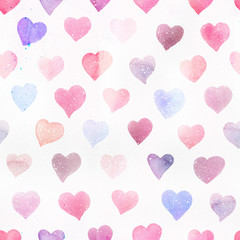 Seamless watercolor pattern with colorful hearts - romantic light and soft tints of pink and red.