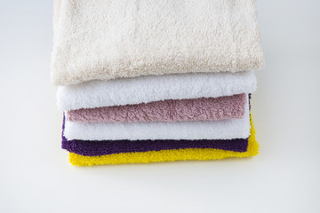 on a white table color towels