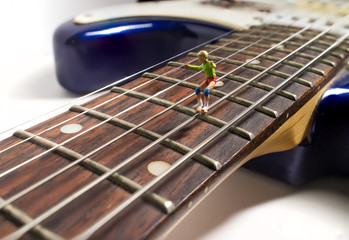 Obraz premium Miniature Skaters Guitar