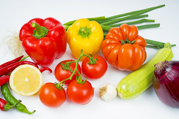 Heap of vegetables isolated on white background