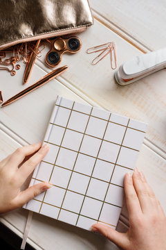 rose gold stationery tabletop, diary with hands
