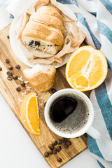 Morning coffee with croissant on the table