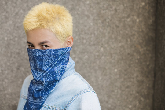 young asian woman covered face with blue headscarf