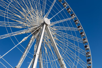 Fototapeta premium Ferris wheel Roue de Paris at Place de la Concorde. Sunny day. Travel to famous landmarks