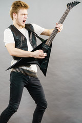 Fototapeta premium Man playing rock on electric guitar