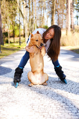 Fototapeta premium Outdoors lifestyle portrait of a beautiful girl wearing roller s