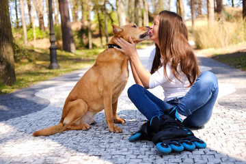 Outdoors lifestyle portrait of a beautiful girl wearing roller s