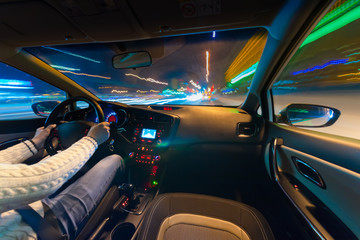 Car speed night drive on the road in city