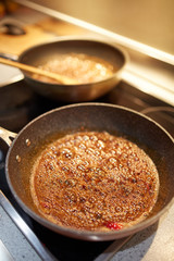 Brown sugar caramelizing in a pan