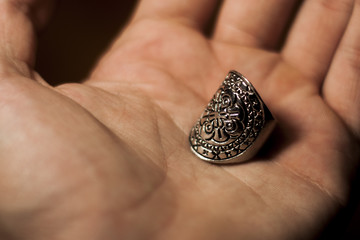 Focused old designed silver rings on hand