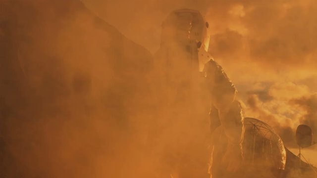 Following Shot of the Astronaut On Mars Walking Toward His Base/ Research Station. Manned Mission To Mars, Technological Advance Brings Space Exploration, Colonization. 