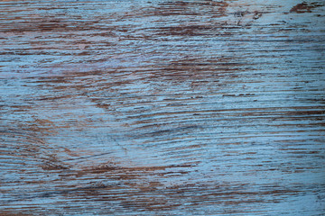 Natural wooden pattern background of scratched blue painted pine