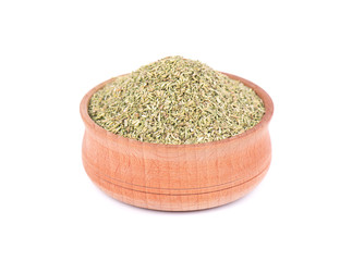 Dried Rosemary in wooden bowl for spices isolated on white background. Crushed rosemary. Closeup