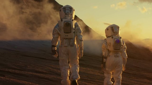 Two Astronauts Walking on Alien Planet. 