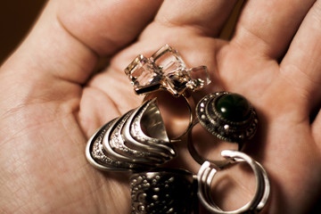 a lot of fashion rings in the hands