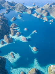 Aerial View of Calm Lagoon and Rock Islands in Raja Ampat