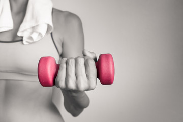 Workout fitness concept. Female holding dumbbell weight. 