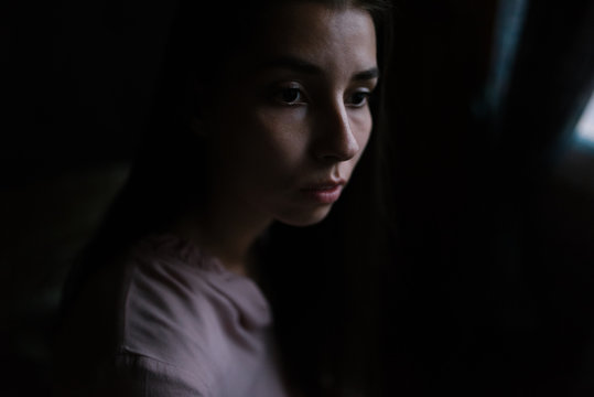 Portrait of woman in darkness