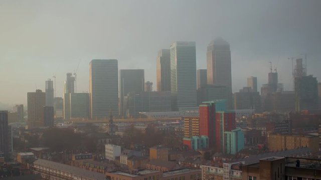 A drone shot of Canary Wharf on a foggy morning.