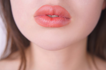 Obraz premium Beautiful woman lips. Lip filling injections, make up, beauty and cosmetic concept