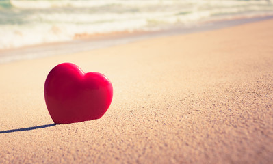Heart in the sand.  Beach holiday background. 
